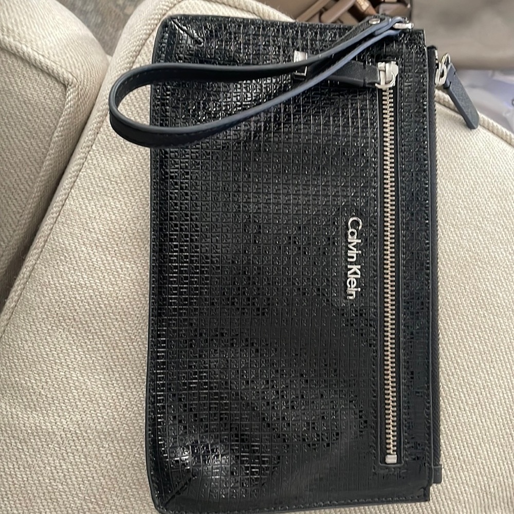 Calvin Klein embossed wristlet with silver accents